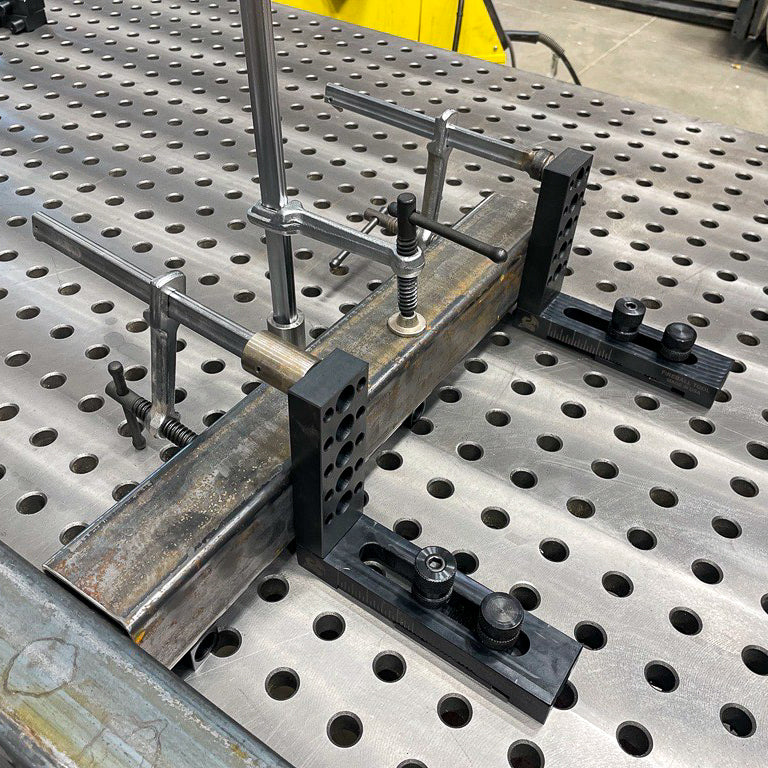 Welding table store clamping system